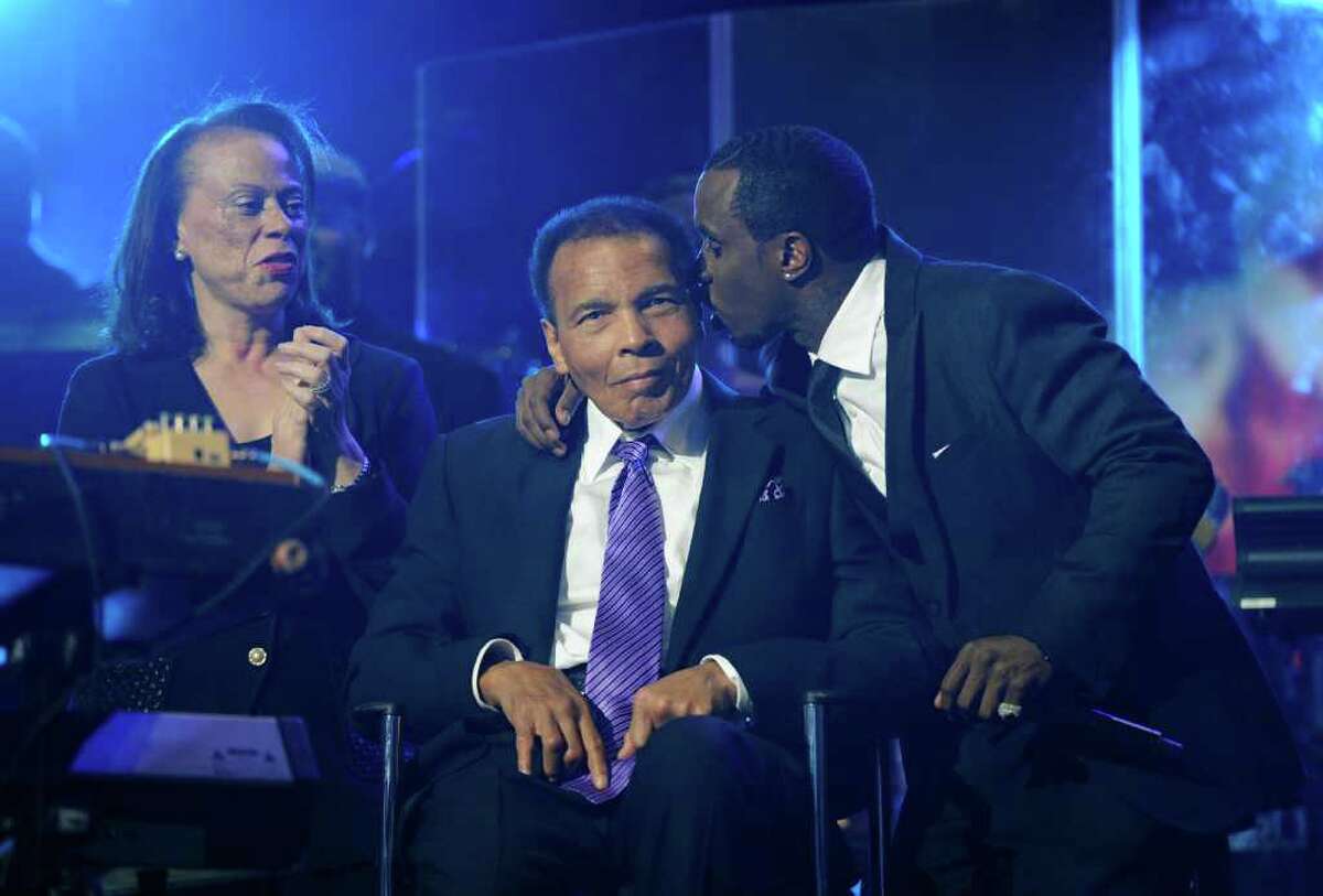 Sean "Diddy" Combs, right, joins boxing legend Muhammad Ali and Ali's wife, Lonnie, at the Keep Memory Alive foundation's "Power of Love Gala" in Las Vegas.