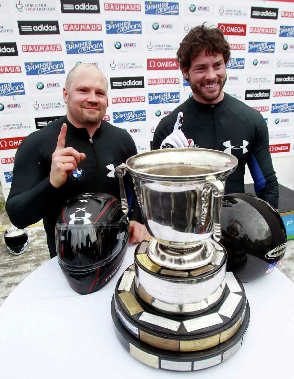 USA's pilot Steven Holcomb, left, and brakeman Steven Langton react after winning the men's two-man bobsled world championships in Lake Placid, N.Y., on Sunday, Feb. 19, 2012. (AP Photo/Mike Groll)