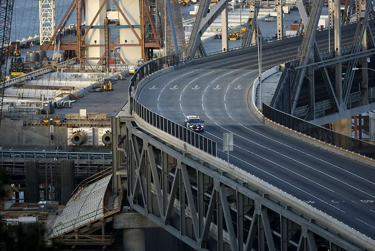 A lone highway patrol car is seen on the Bay Bridge from Treasure Island on Sunday, February 19, 2012. The Bay Bridge was closed due to construction and demolish throughout the weekend.