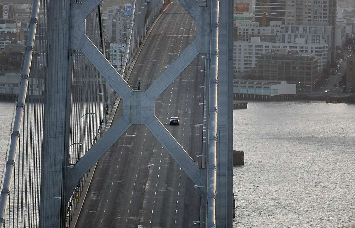 A lone car is seen on the Bay Bridge from Treasure Island on Sunday, February 19, 2012. The Bay Bridge was closed due to construction and demolish throughout the weekend.
