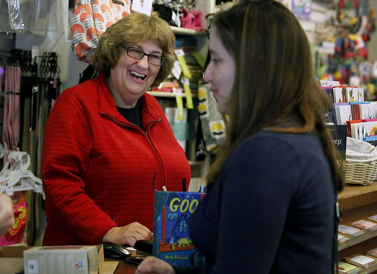 Store owner Carol Yenne (left) assists Dawn Deems at Yenne's Small Frys childrens' clothing store in the Noe Valley neighborhood of San Francisco, Calif. on Friday, Feb. 17, 2012. Noe Valley has continued to be a hot real estate market.