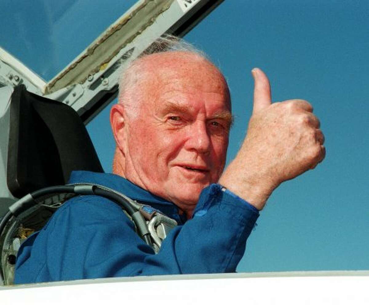 Sen. John Glenn, D-Ohio, gives the thumbs up to a photographer as he sits in the back seat of a T-38 jet after arriving at Kennedy Space Center's Shuttle Landing Facility Monday afternoon, Oct. 26, 1998 in Cape Canaveral. (AP Photo/NASA, George Shelton) (GEORGE SHELTON / AP)