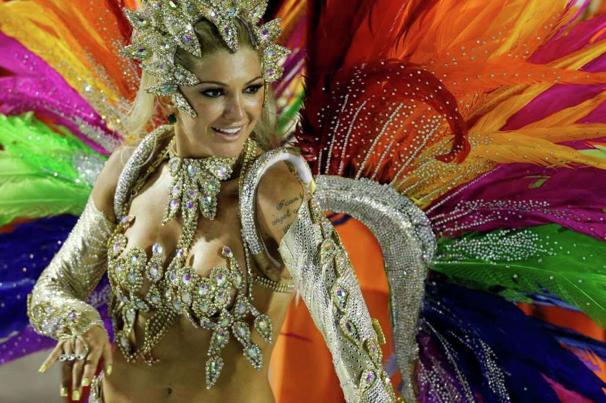 A dancer from Mocidade samba school parades during carnival celebrations at the Sambadrome in Rio de Janeiro, Brazil, Monday.