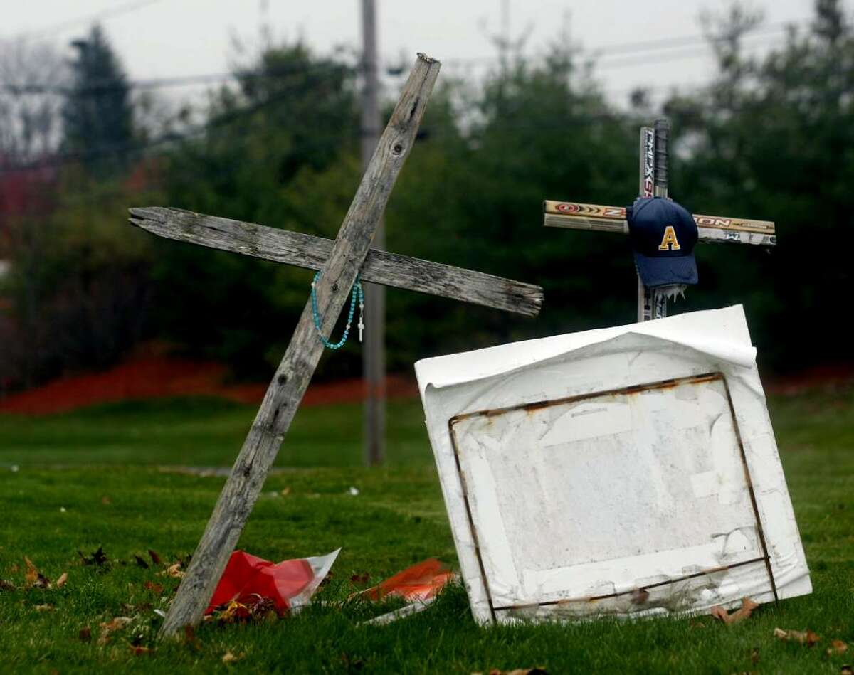 A memorial still stands near the intersection of the Post Road at Dogwood Road in Orange where teenagers Dave Servin and Ashlie Krakowski were killed in the early morning hours of June 13, 2009 when their Mazda was broadsided by Milford officer Jason Anderson’s police cruiser.