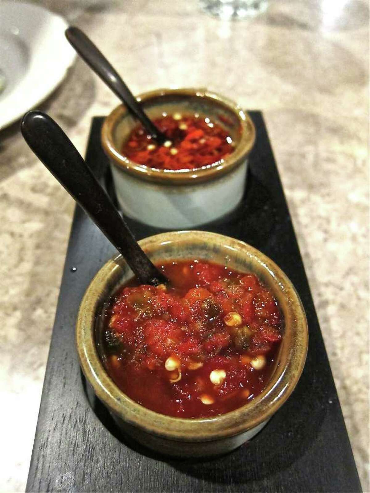 Chile sauce, foreground, and Thai-chile dip