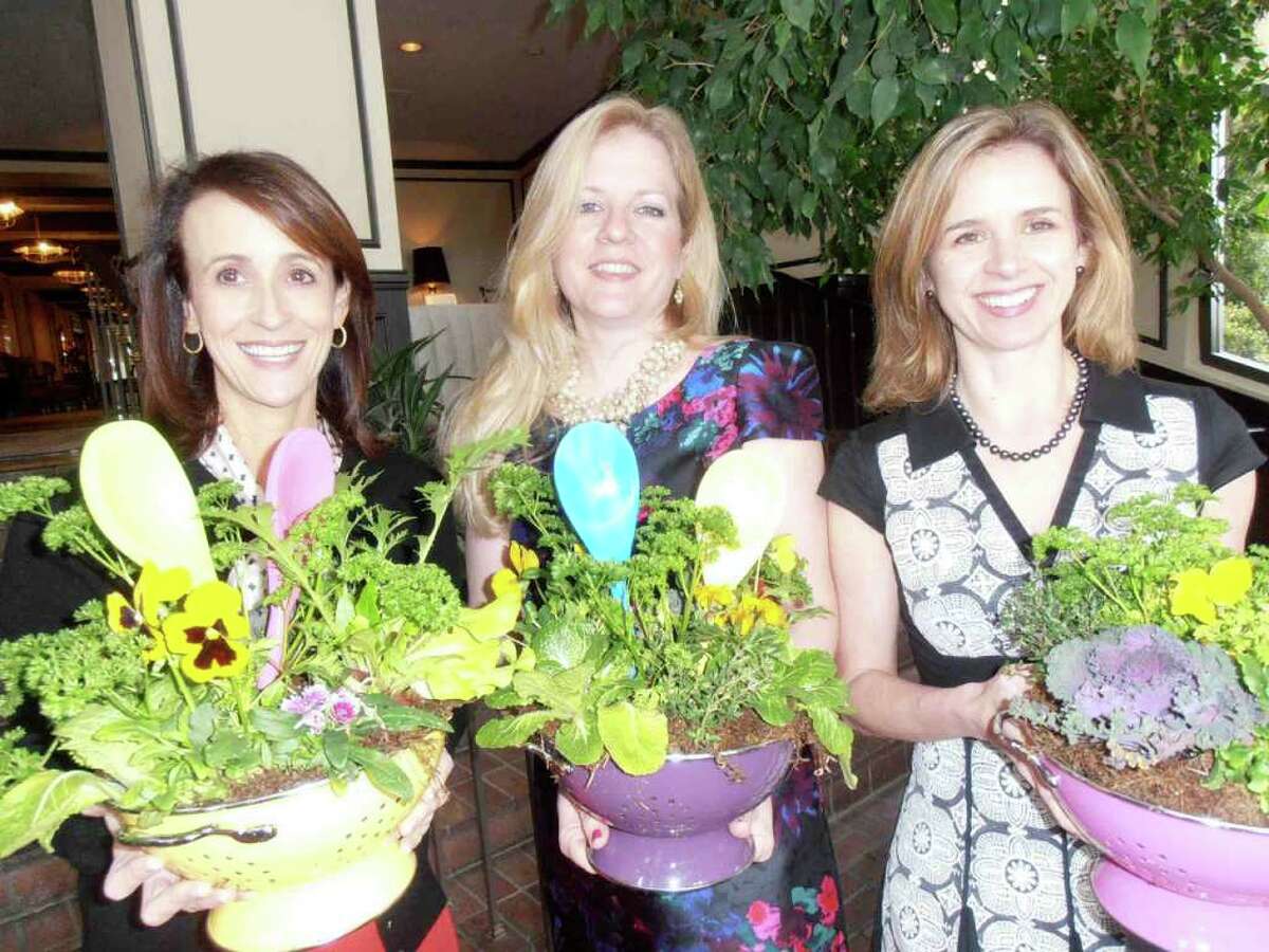 Lisa Sechler, from left, and event co-chairs Heather Kraft and Gretchen Herrmann show off edible centerpieces at Pi Beta Phi's Alumnae Club Foundation's "Gourmet Soiree" with New Orleans chef John Besh.
