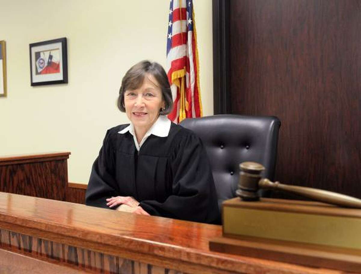 DAVID HOPPER: FOR THE CHRONICLE ON THE BENCH: Precinct 3 Justice of the Peace Edie Connelly will be marrying seven couples inside her courtroom on Valentine's Day this year. DAVID HOPPER: FOR THE CHRONICLE ON THE BENCH: Precinct 3 Justice of the Peace E