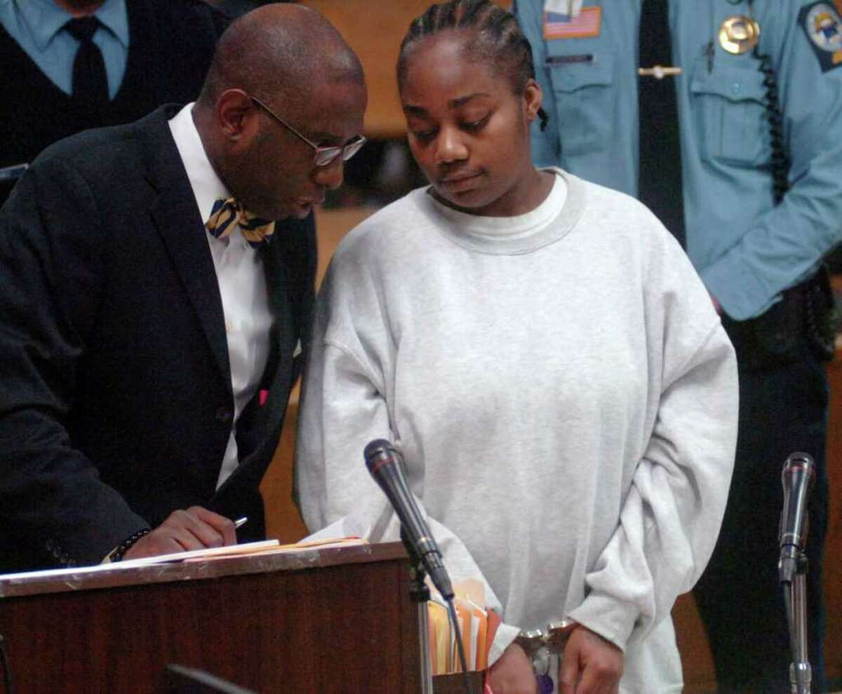 Tanya McDowell stands with her defense attorney, Darnell Crosland, during her appearance in Superior Court in Norwalk, Conn. on Wednesday, Feb. 22, 2012. McDowell, the Bridgeport mom arrested in April 2011 and charged with first-degree larceny for sending her then 5-year-old son to a Norwalk elementary school, will serve five years in prison and another five years of probation after pleading guilty to the larceny charge. McDowell will be issued a 12-year sentence suspended after five years. She also pleaded guilty to four counts of sale of narcotics -- counts that will be included in her prison sentence.