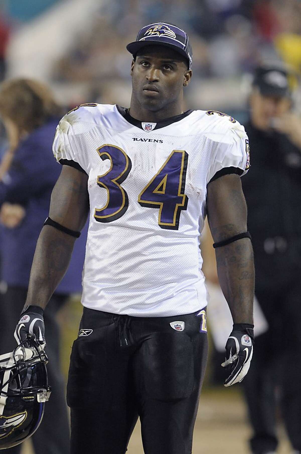 In this Oct. 24, 2011, photo, Baltimore Ravens running back Ricky Williams watches from the sideline during an NFL football game against the Jacksonville Jaguars in Jacksonville, Fla. Williams is retiring. The 34-year-old Williams told the Ravens on Tuesday, Feb. 7, 2012, he won't be back to fulfill the second year of a contract he signed in August. Playing as a backup to Ray Rice this year, Williams ran for 444 yards and scored two touchdowns. (AP Photo/Phelan M. Ebenhack)