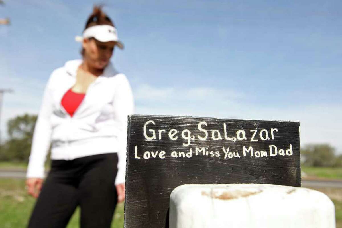 Salazar stands by a homemade memorial for her husband, killed by a drunken driver four years ago.