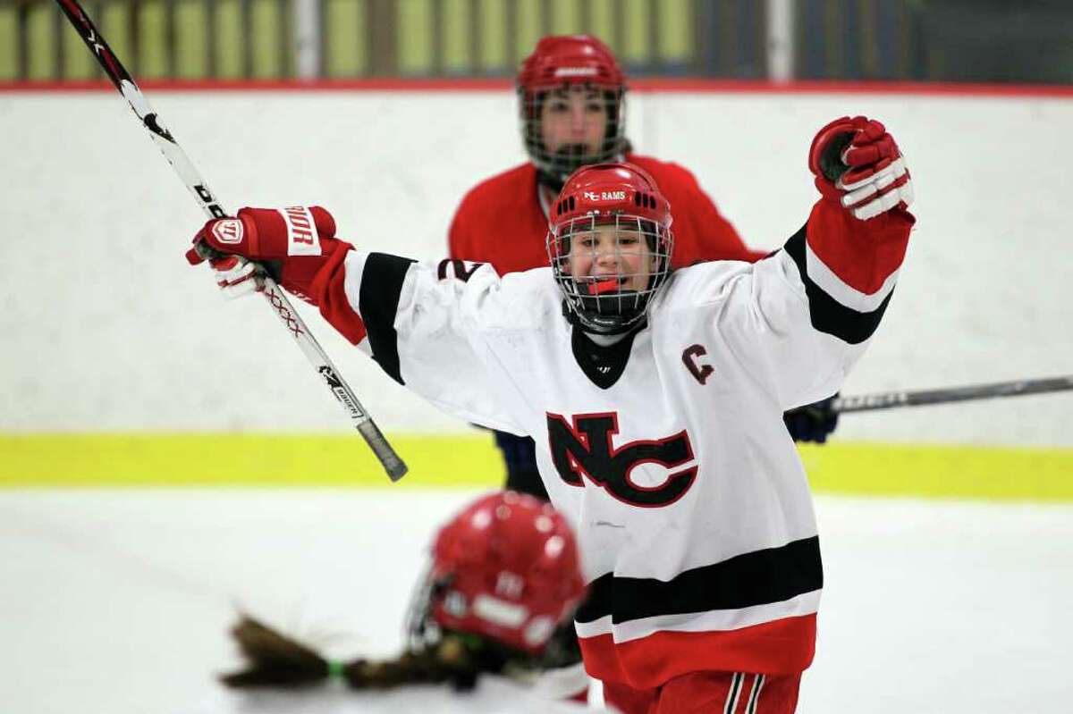 New Canaan hockey player Olivia Hompe celebrates her score in the FCIAC girls ice hocey championship at Terry Conners Rink in Stamford, Conn. on Saturday, Feb. 25, 2012. Hompe, the MVP in the game, led her Ram teammates to a 8-0 win over Greenwich High School.