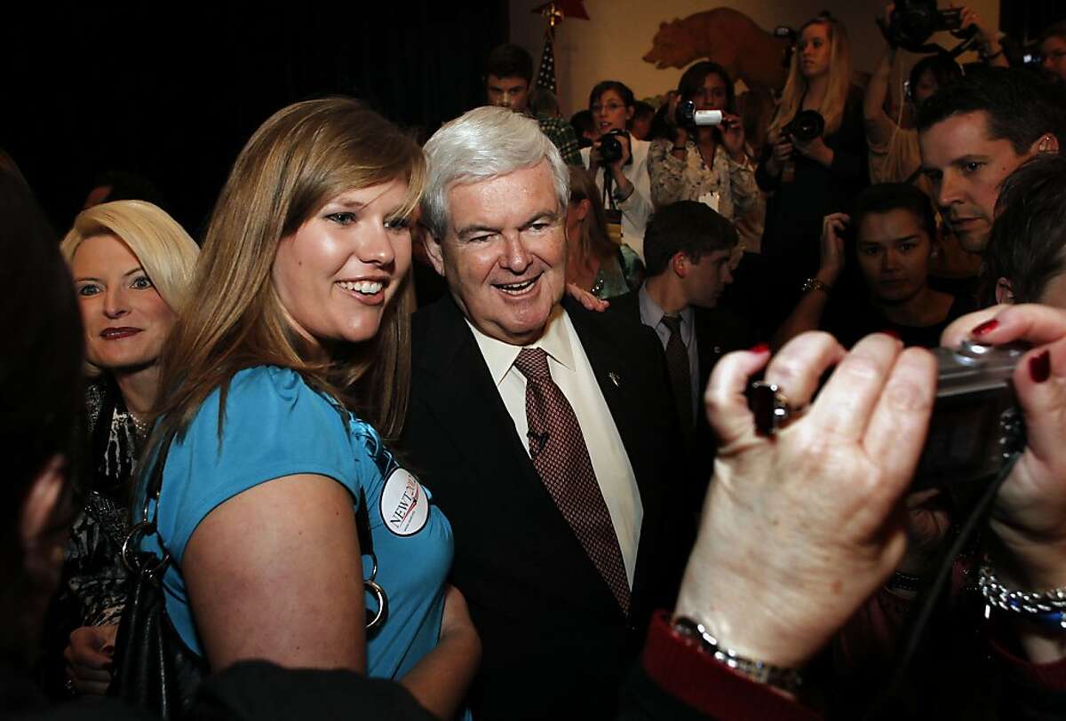Presidential candidate and former house speaker, Newt Gingrich the keynote speaker at the afternoon luncheon, stops for a photograph with Hannah Plummer of Marina, Ca., following his speech on day two of the California Republic Party State Convention on Saturday Feb. 25, 2012, in Burlingame, Ca.