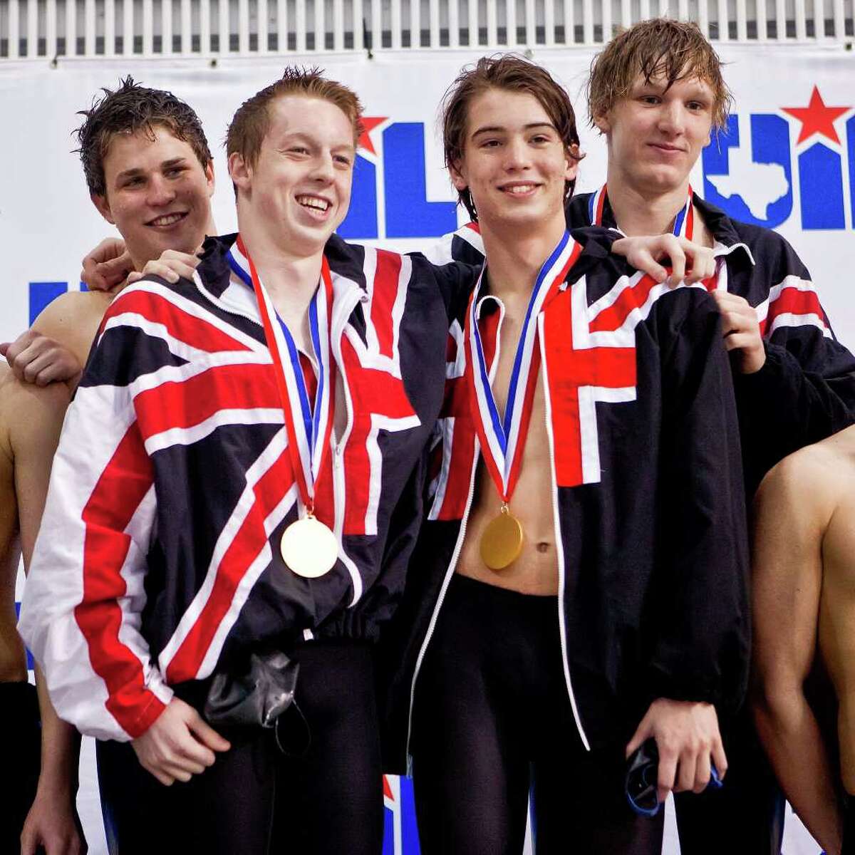 Churschill's boys' 200-yard medley relay team — John Murray (from left), William Glasscock, Liam Lockwood and Dory Boleter — collect their gold medals on the medal stand in the finals of the 5A Swimming and Diving State Meet at the Jamail Texas Swim Center in Austin on Saturday, Feb. 25, 2012.