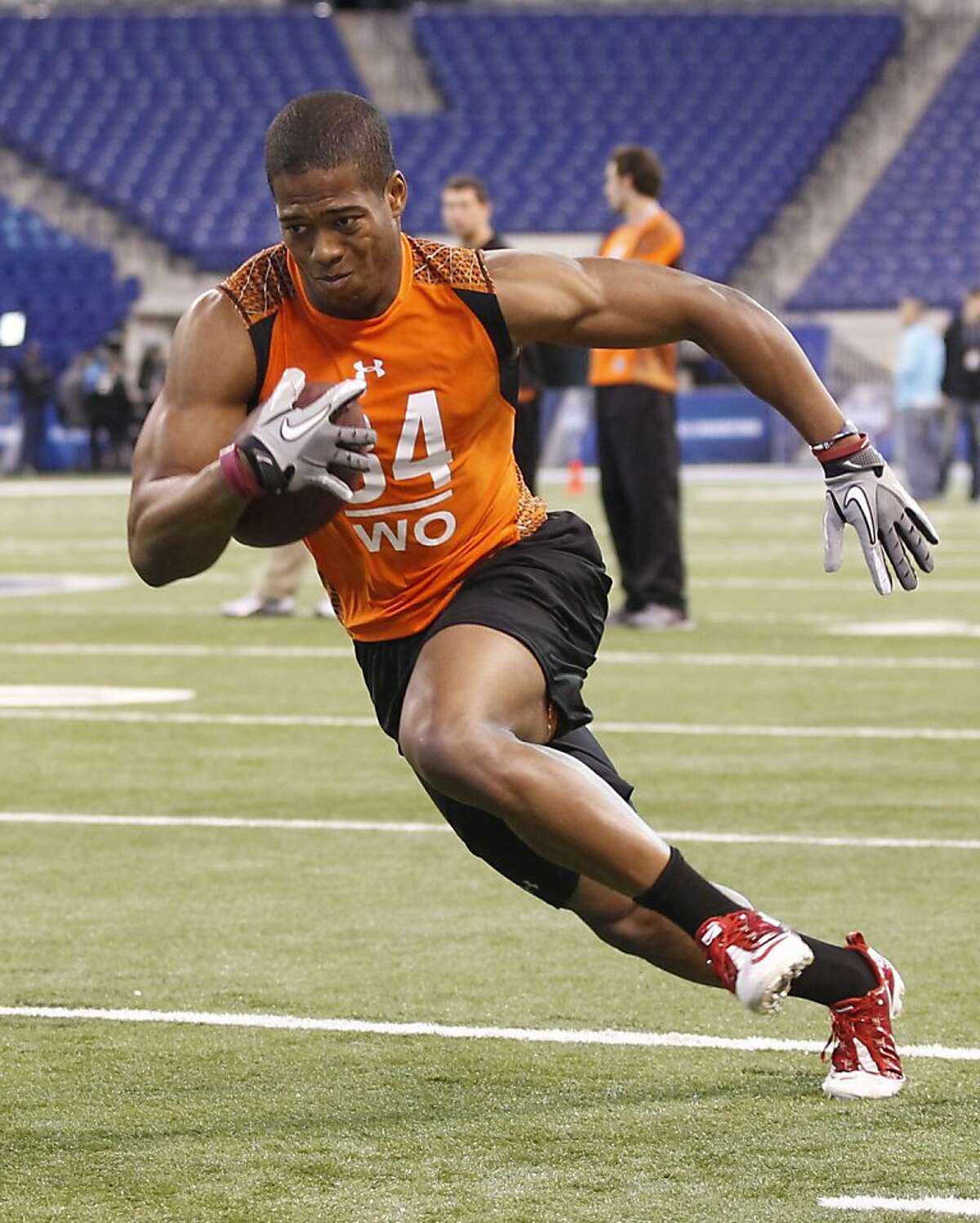 Stanford receiver Chris Owusu runs a drill at the NFL football scouting combine in Indianapolis on Sunday, Feb. 26, 2012. (AP Photo/Dave Martin)