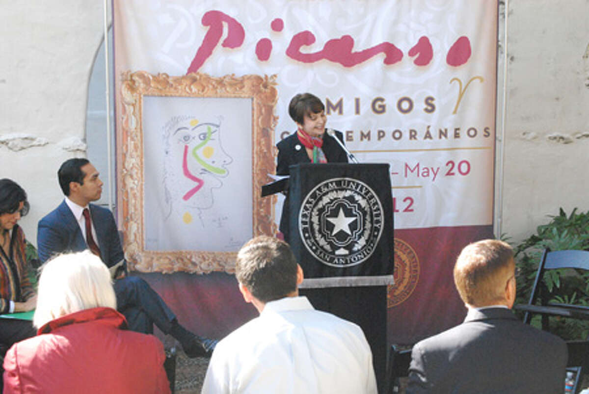 Maria Hernandez Ferrier, president of Texas A&M University-San Antonio, speaks during the press conference to discuss the Picasso exhibit as Mayor Julián Castro looks on.