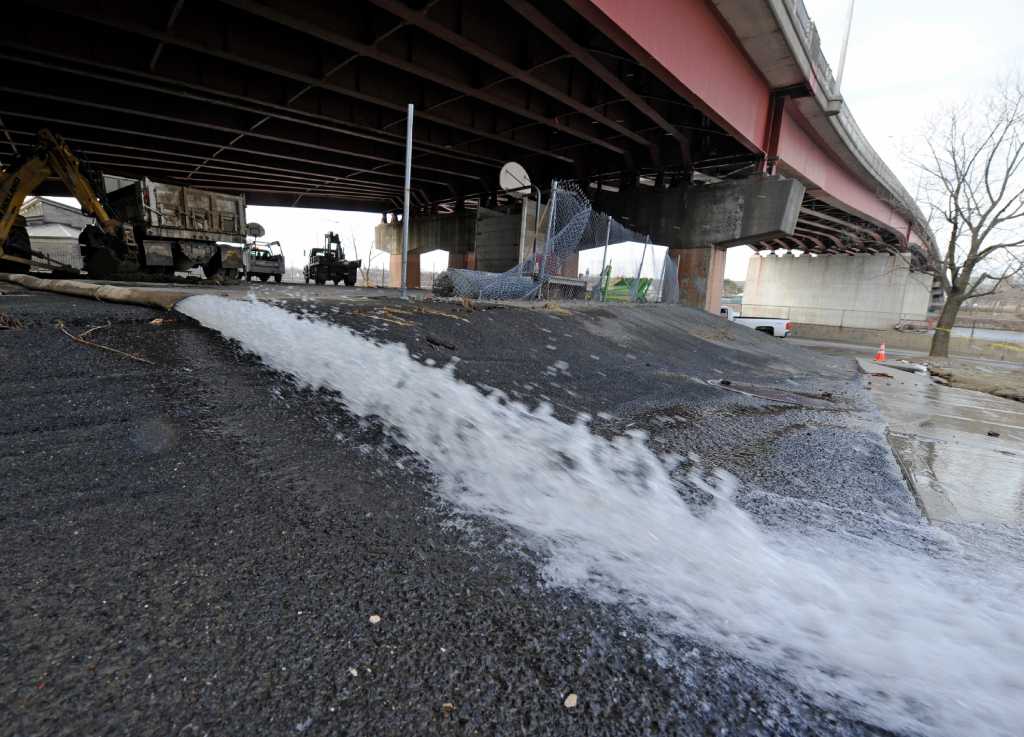 Photos: Water main break repairs underway