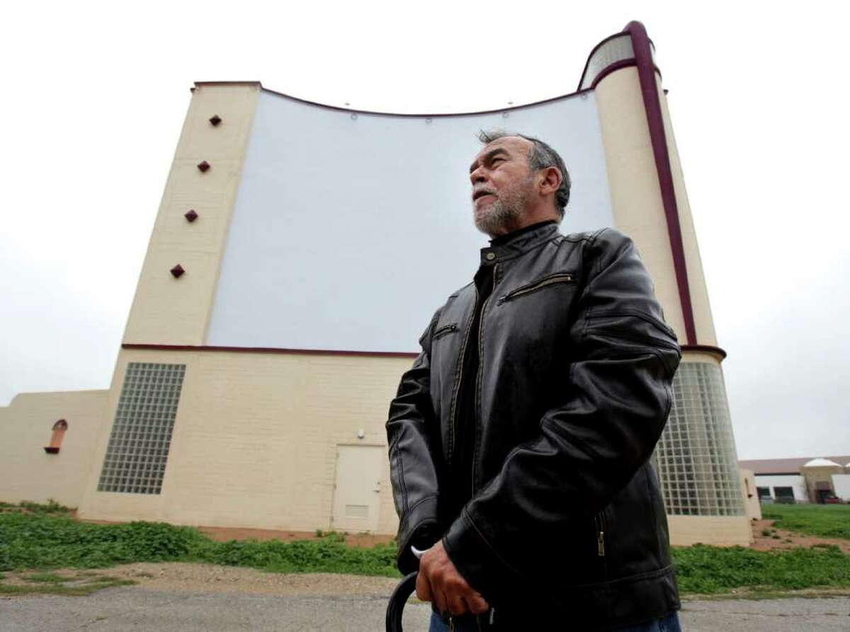 South Side residents and artists, including Jesse Trevino, gather at the old Mission Drive In to protest the plan by the City of San Antonio to recreate the historic marquee at the drive in. Monday, Feb. 27, 2012. Bob Owen/Express-News