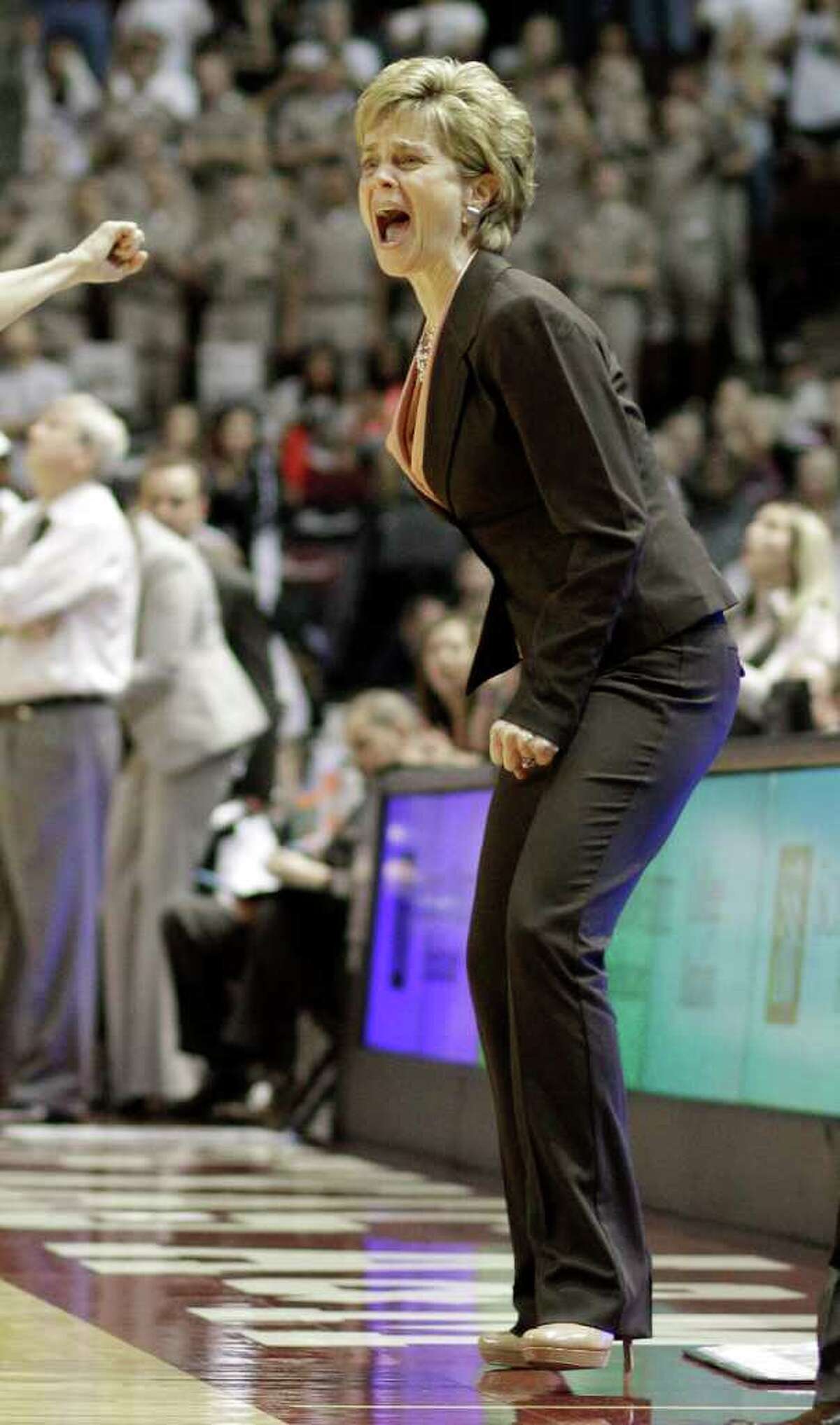 Baylor coach Kim Mulkey yells from the sidelines in the second half of an NCAA college basketball game against Texas A&M on Monday, Feb. 27, 2012, in College Station. Baylor won 69-62.