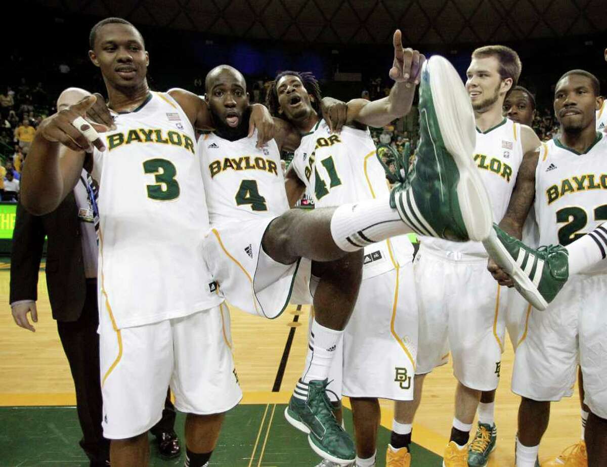 Baylor 's Fred Ellis (3), Quincy Acy (4) and Anthony Jones (41) celebrate with Jacob Neubert, second from right, and A.J. Walton (22) following an NCAA college basketball game against Texas Tech Monday, Feb. 27, 2012, in Waco. Ellis, Acy and Jones, graduating seniors, played their final home game for Baylor in the 77-48 win.