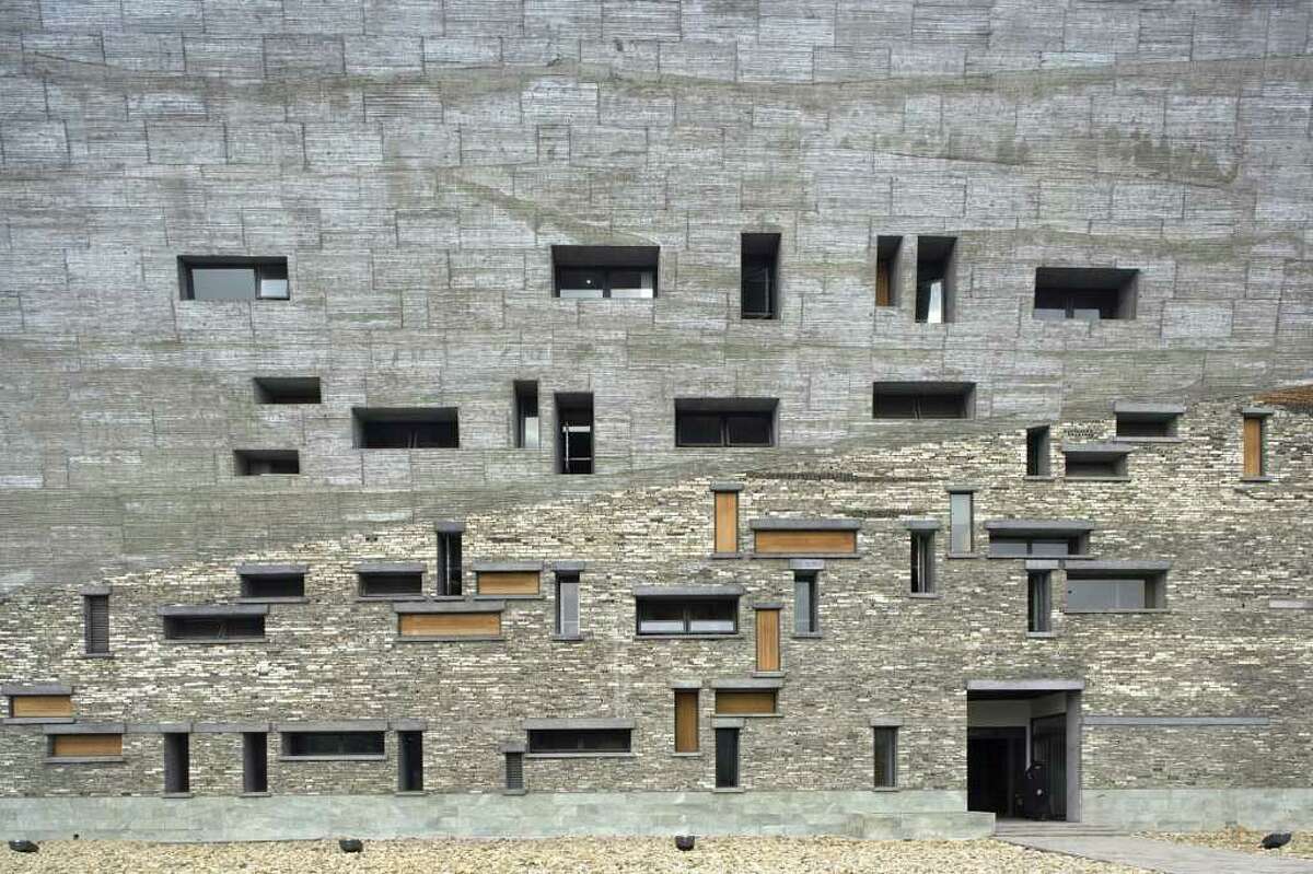 In this undated image released courtesy of The Hyatt Foundation, an exterior view of the Ningbo History Museum, designed by Chinese architect Wang Shu, is shown in Ningbo, China. Shu, whose buildings have been praised for their commanding presence and careful attention to the environment, has won the 2012 Pritzker Architecture Prize, the prize's jury announced Monday, Feb. 27, 2012. (AP Photo/Amateur Architecture Studio via The Hyatt Foundation, Lv Hengzhong) NO SALES