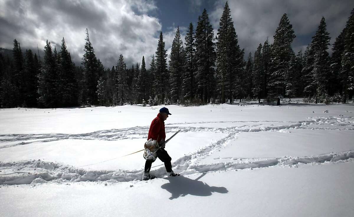 Frank Gehrke, chief of snow surveys for the Department of Water Resources, walks across a snow-covered meadow after conducting a snow survey near Echo Summit Calif., Tuesday, Feb. 28, 2012. Despite recent storms the survey showed the snow pack to be only 17.7 inches deep with a water content of only 3.9 inches_ which is only 16 percent of normal for this location at this time of the year. (AP Photo/Rich Pedroncelli)