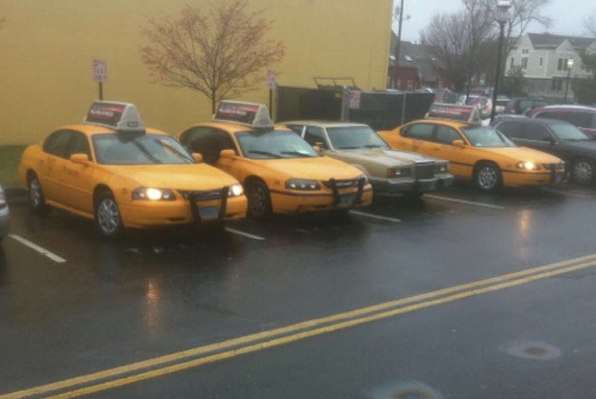 Yellow Cab of Bridgeport, which on Wednesday afternoon took over ownership of the troubled Fairfield Cab Co., dispatched a fleet of its vehicles for the evening rush at the Fairfield Railroad Station.