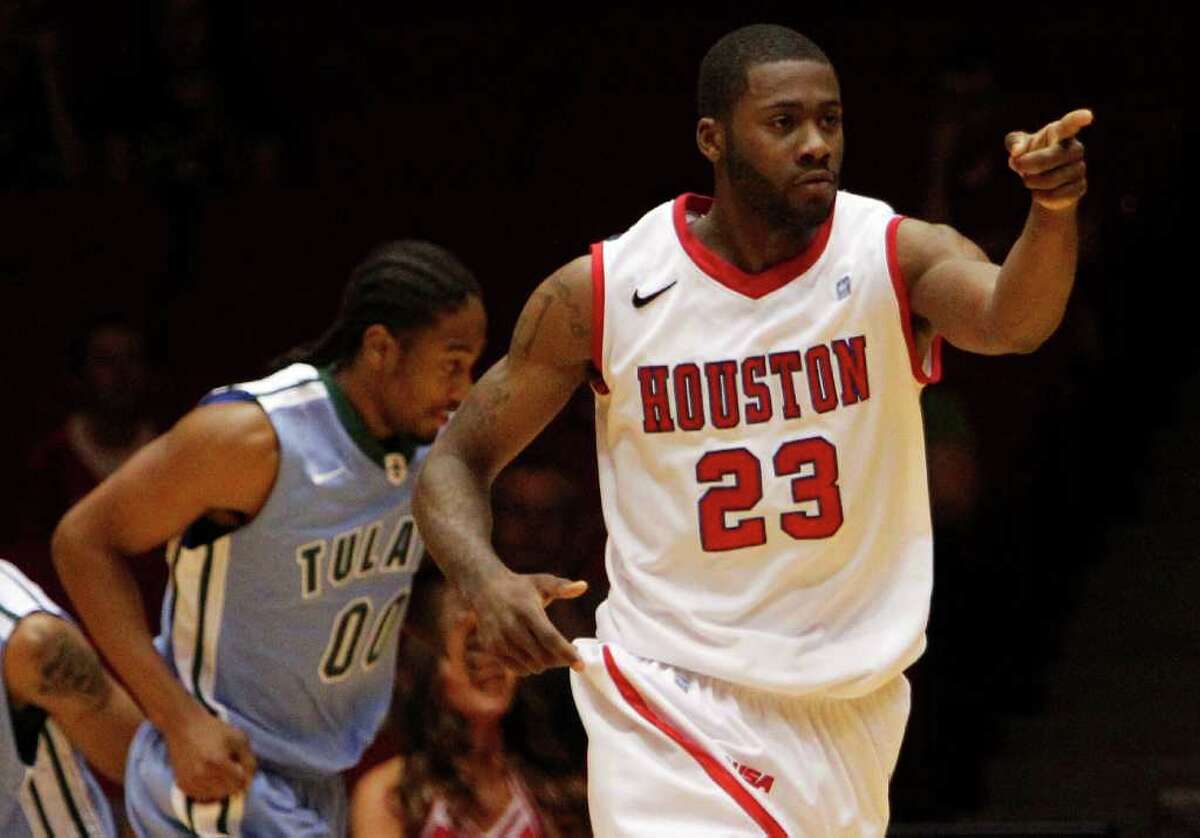 The University of Houston's Jonathon Simmons points his finger after scoring a shot against Tulane University during the first half of men's college basketball game action at the University of Houston's Hofheinz Pavilion Wednesday, Feb. 29, 2012, in Houston.