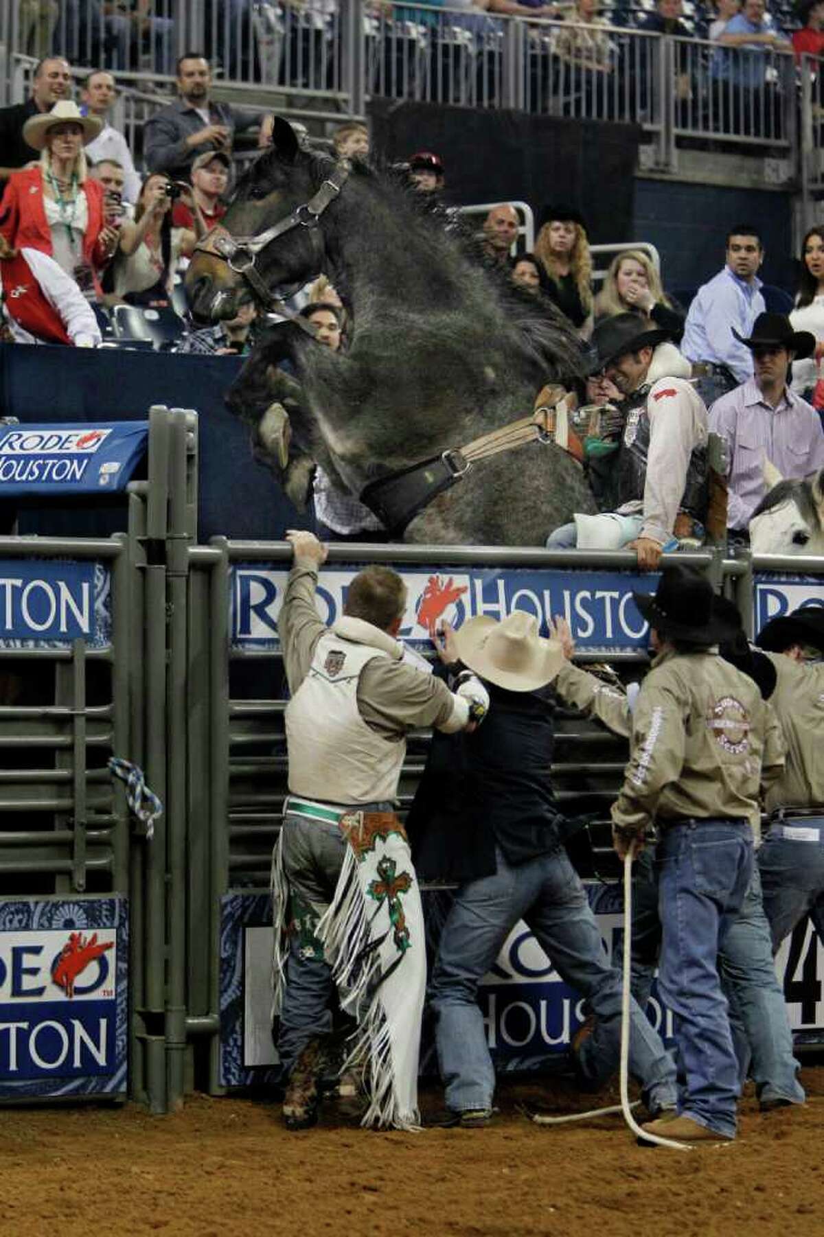 Steven Anding hangs on as his horse is up on it's hind leg right before competing in Bareback Riding during the Rodeo Houston BP Super Series I Round 2 at Reliant Stadium on Wednesday, Feb. 29, 2012, in Houston. ( Mayra Beltran / Houston Chronicle )