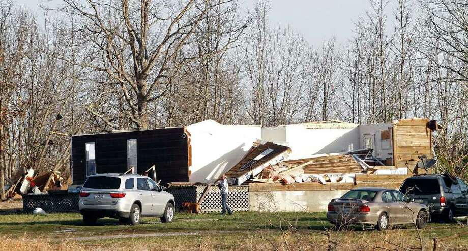 News of the world in photos: Aftermath of killer storms - seattlepi.com