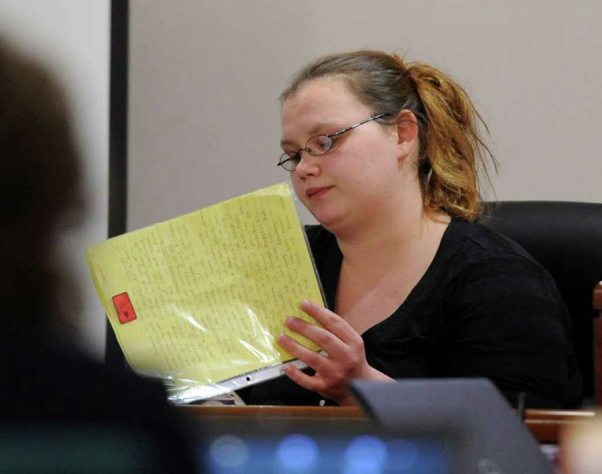 Loretta Colegrove reads a poem sent to her by Matthew Slocum while she testifies during his trial in Washington County Court in Fort Edward, N.Y. March 1, 2012. (Skip Dickstein / Times Union archive)
