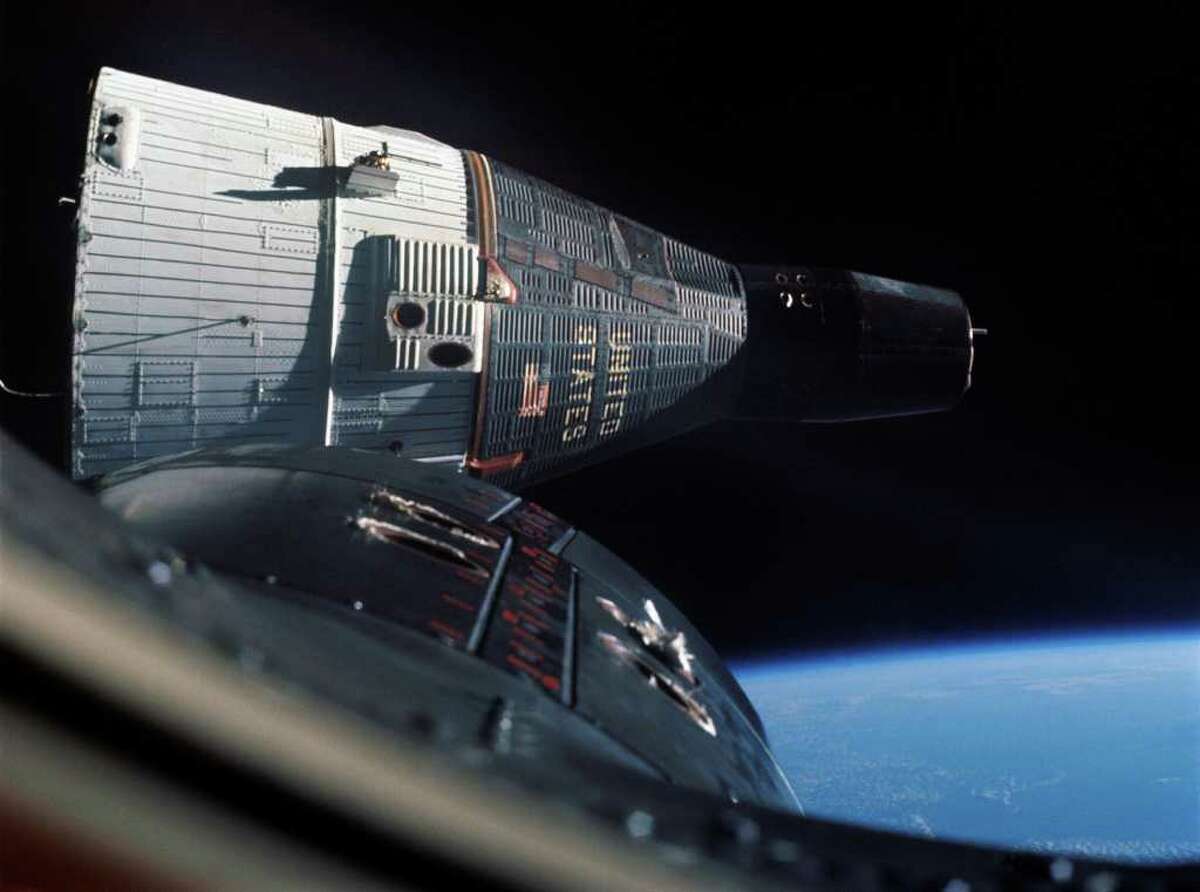 Astronauts Tom Stafford and Wally Schirra broadcast "Jingle Bells" during their Gemini 6 mission as part of a Christmas-themed prank. PHOTO: Gemini VII is seen from the hatch window of Gemini VI.