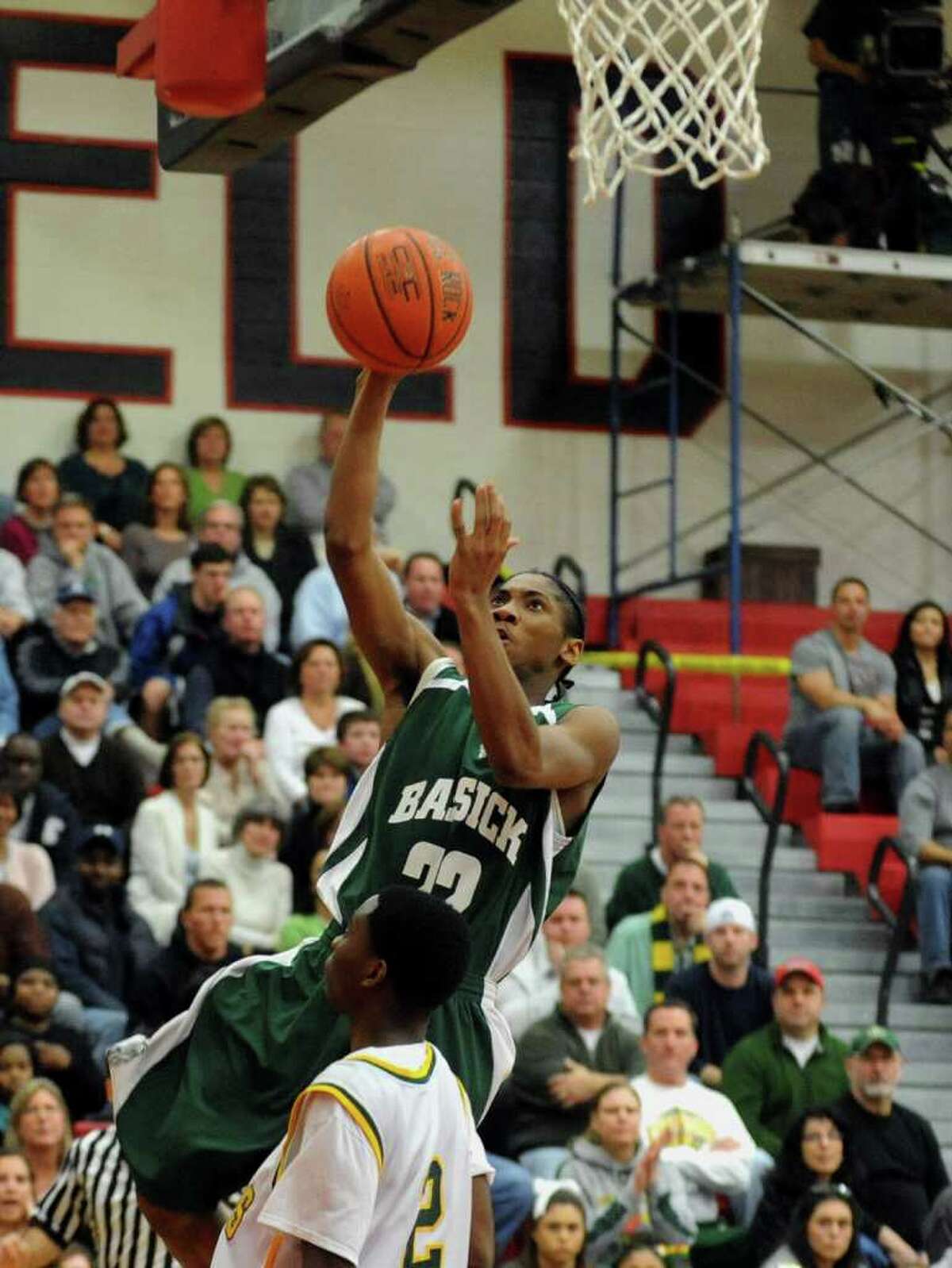 Bassick's Pashien Young lays up for two points, during FCIAC Boys' Basketball Championship action against Trinity Catholic in Fairfield, Conn. on Thursday March 1, 2012.