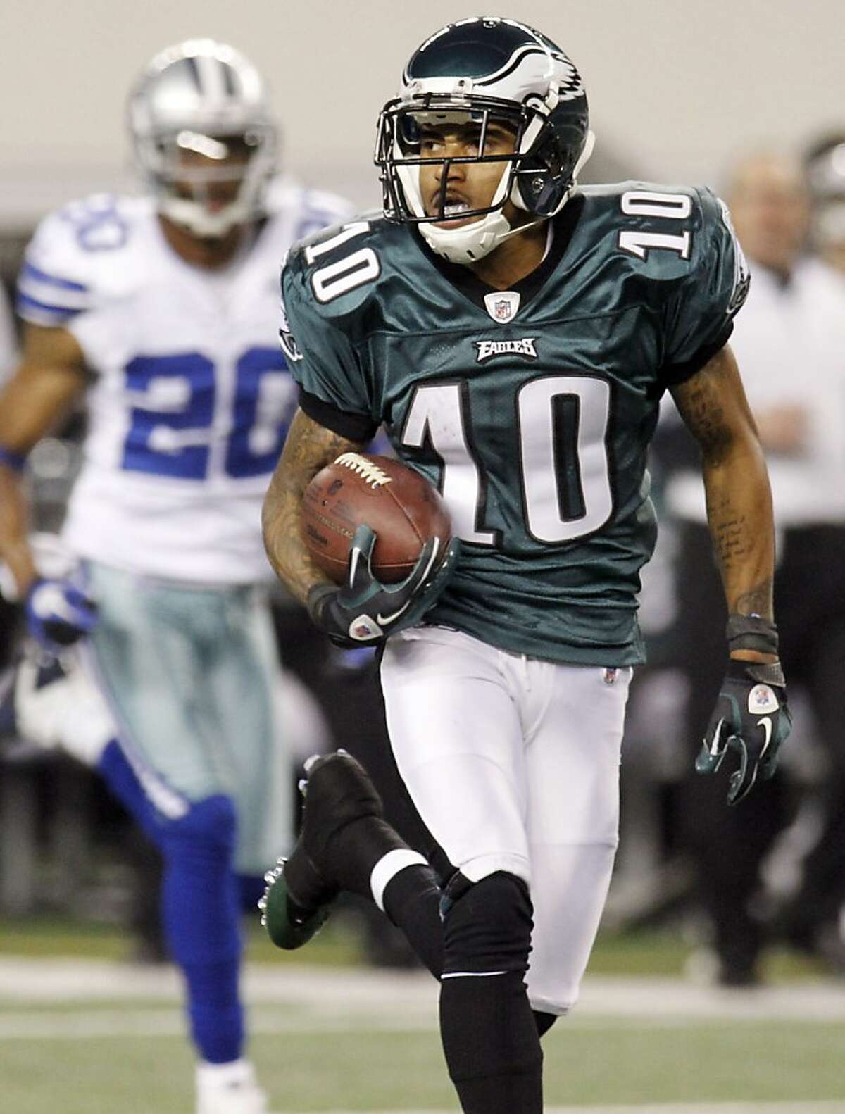 After catching the ball, Philadelphia Eagles wide receiver DeSean Jackson runs for a 91-yard touchdown against the Dallas Cowboys during the second half of an NFL football game, Sunday, Dec. 12, 2010, in Arlington, Texas.