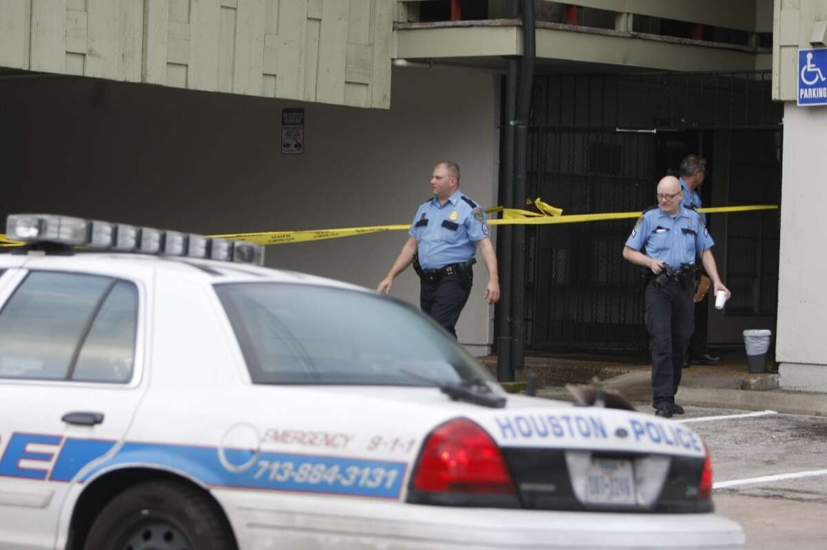 Police secure the scene of Friday's stabbing. (Johnny Hanson/Chronicle)