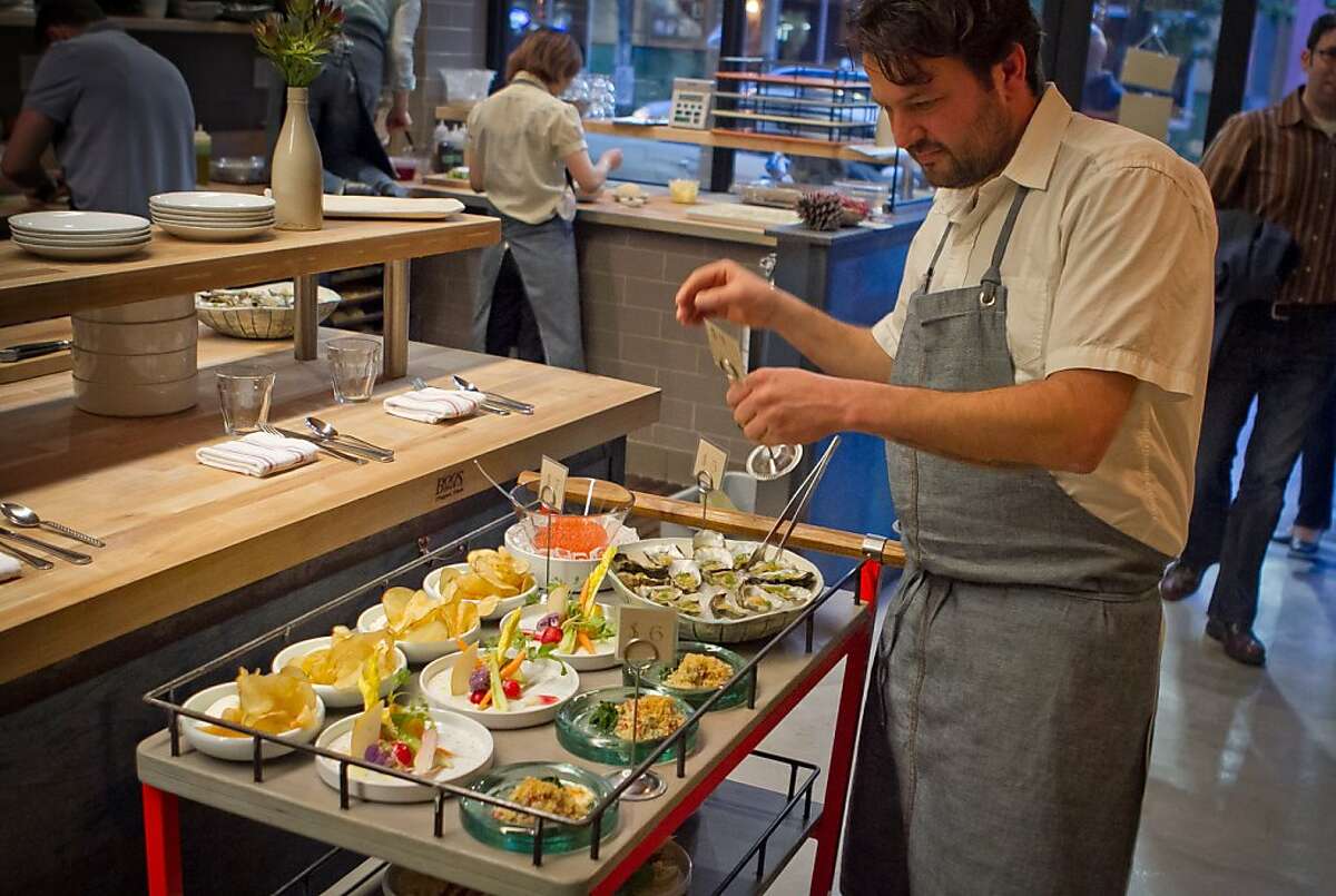 Chef Stuart Brioza puts prices on the food cart at State Bird Provisions in San Francisco, Calif., on Saturday, February 25th, 2012.