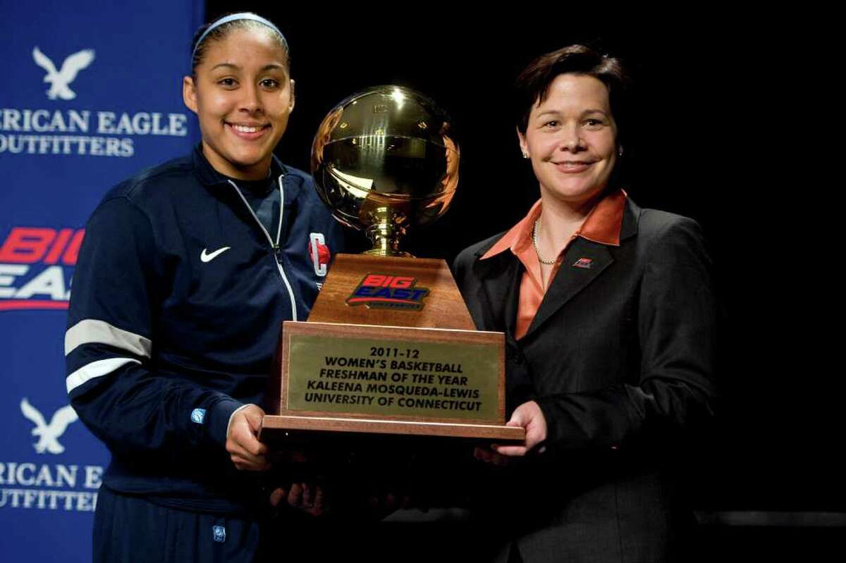 Connecticut's Kaleena Mosqueda-Lewis, left, receives the NCAA college basketball Big East Conference's Freshman of the Year award from associate commissioner Danielle Donehew in Hartford, Conn., Friday, March 2, 2012. (AP Photo/Jessica Hill)