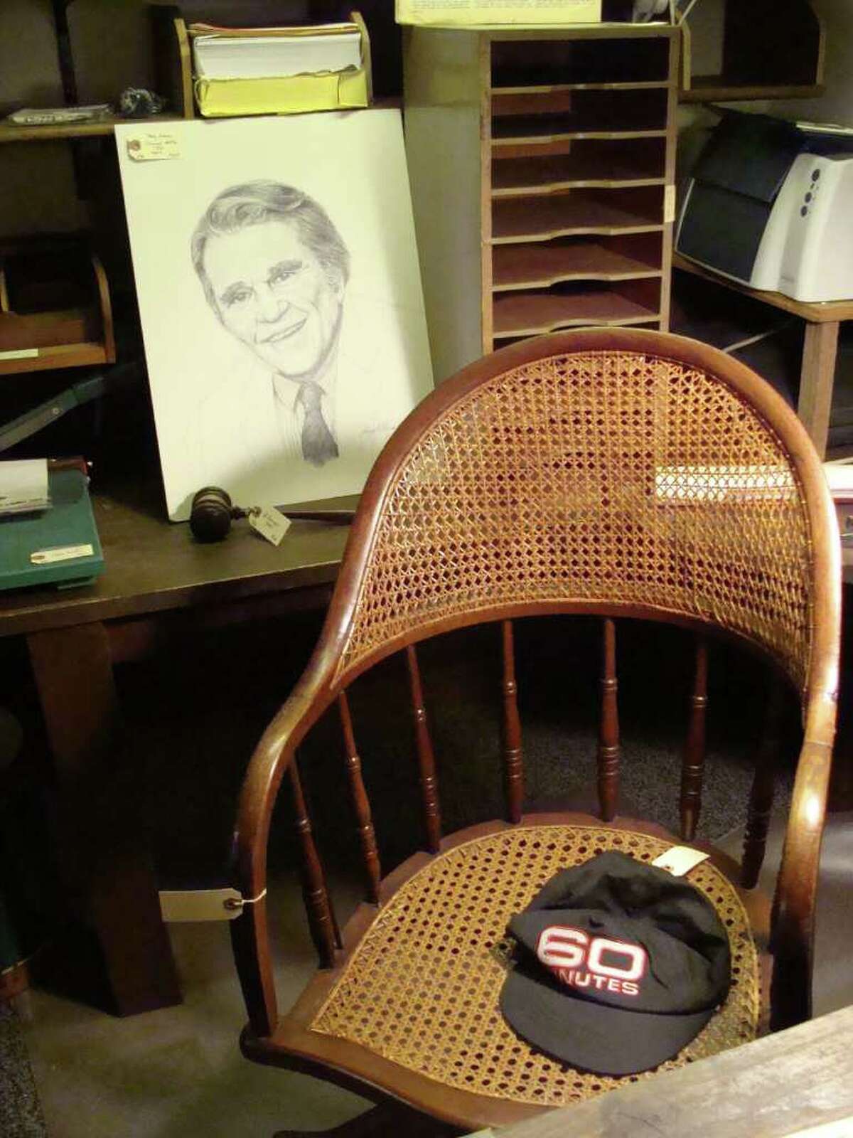 Andy Rooney's basement office chair in his Rowayton home, his "60 Mintues" cap and a portrait were among the items on sale Friday, the first day of a three-day estate sale.