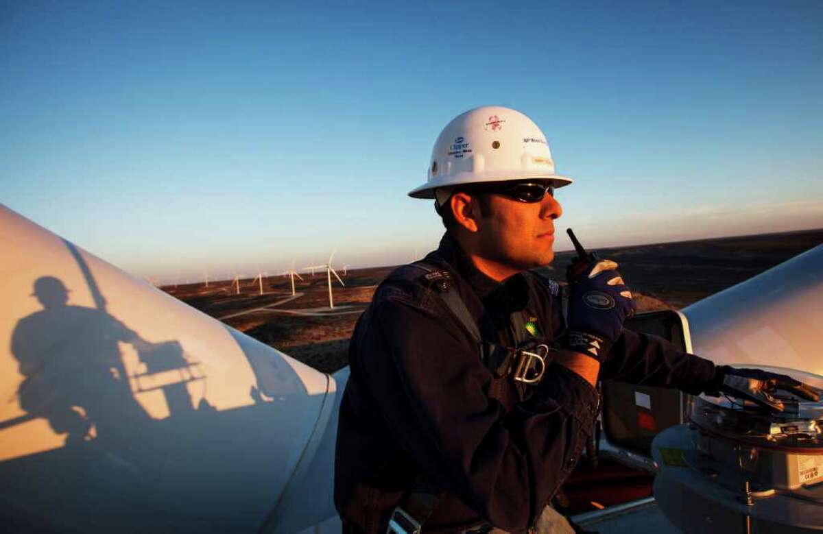 Manny Dominguez of BP's Sherbino 2 wind farm radios the office while working 285 feet in the air atop turbine 53 east of Fort Stockton. BP is beefing up its investments in wind energy and recently launched the wind farm near Fort Stockton, its fourth in Texas.