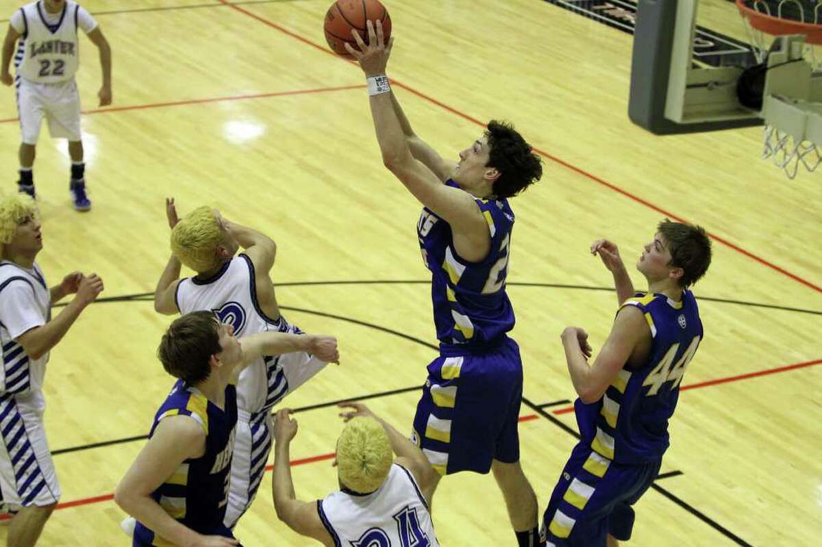 Heights' Jeffrey Rodewald gets the rebound in the second half. Alamo Heights beat Lanier 72-58 in the Region IV-4A semifinals at Littleton Gymnasium, Friday, March 2, 2012. (JENNIFER WHITNEY)