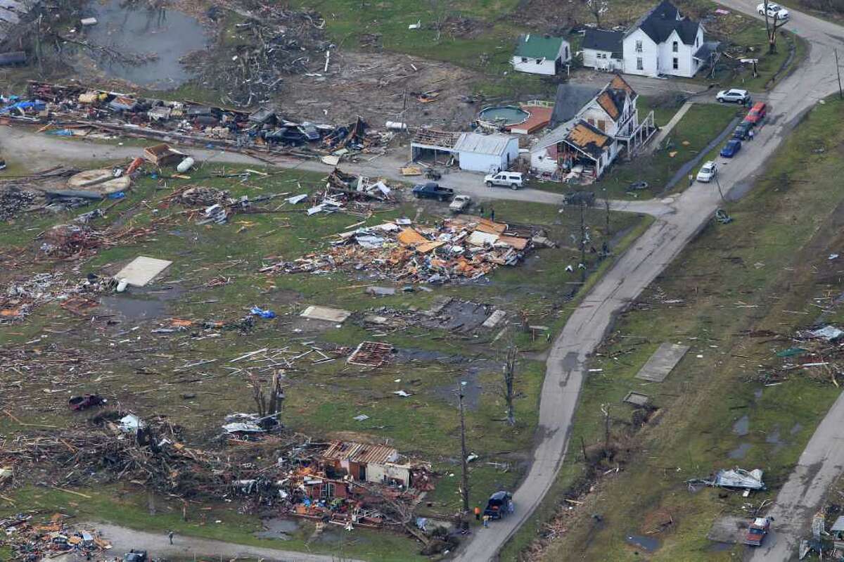 News Of The World In Photos: Towns Vanish In Deadly Storms