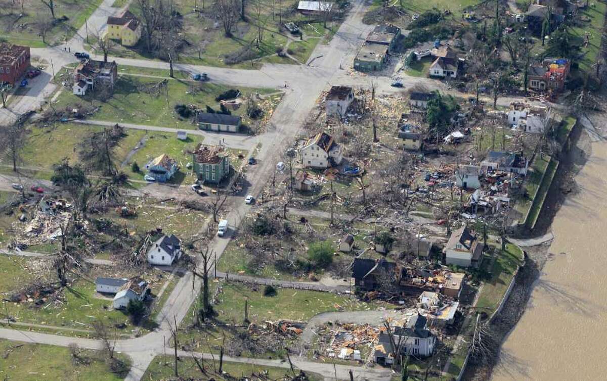 News Of The World In Photos: Towns Vanish In Deadly Storms