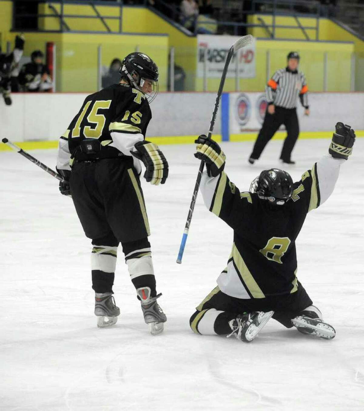 Trumbull's Michael Ahearn, left, and Brendan Strobel, right, celebrate a goal during Saturday's FCIAC Teir II Boys Hockey Final at Terry Conners Rink in Stamford on March 3, 2012.