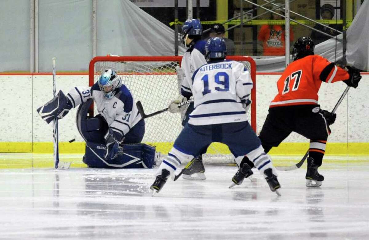 Darien's Max Rothston makes a save during Saturday's FCIAC Teir I Boys Hockey Championship at Terry Conners Rink in Stamford on March 3, 2012.