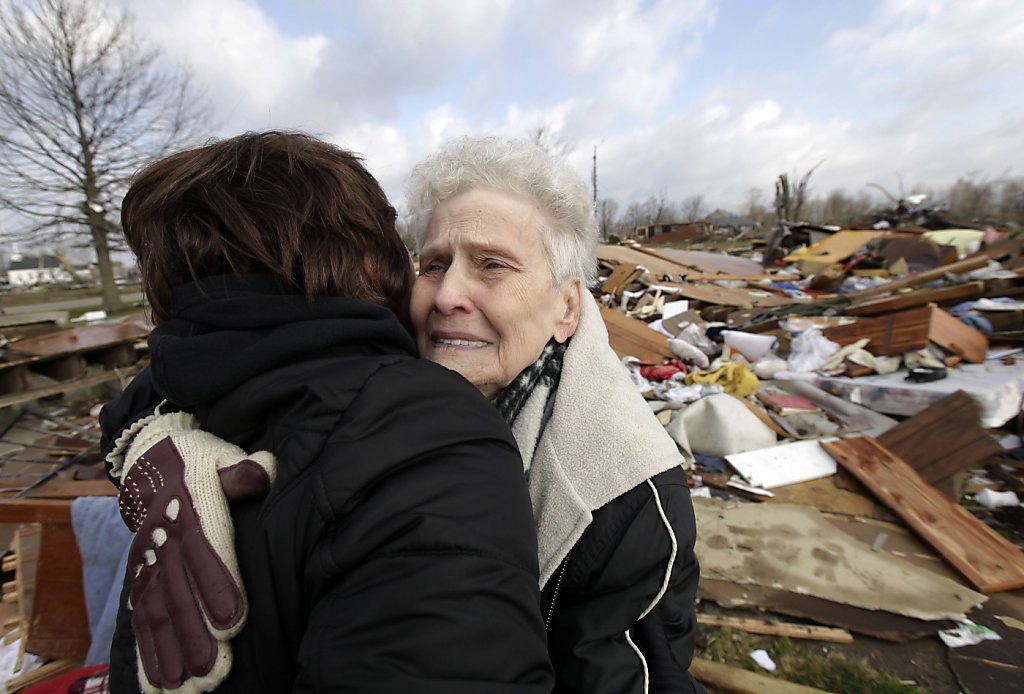 Tornado survivors emerge to find devastation