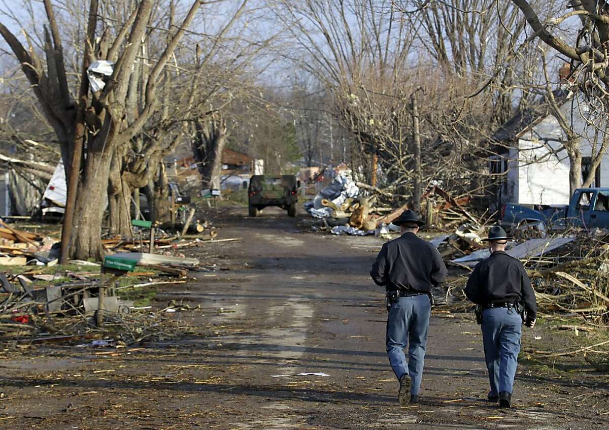 Tornado survivors emerge to find devastation