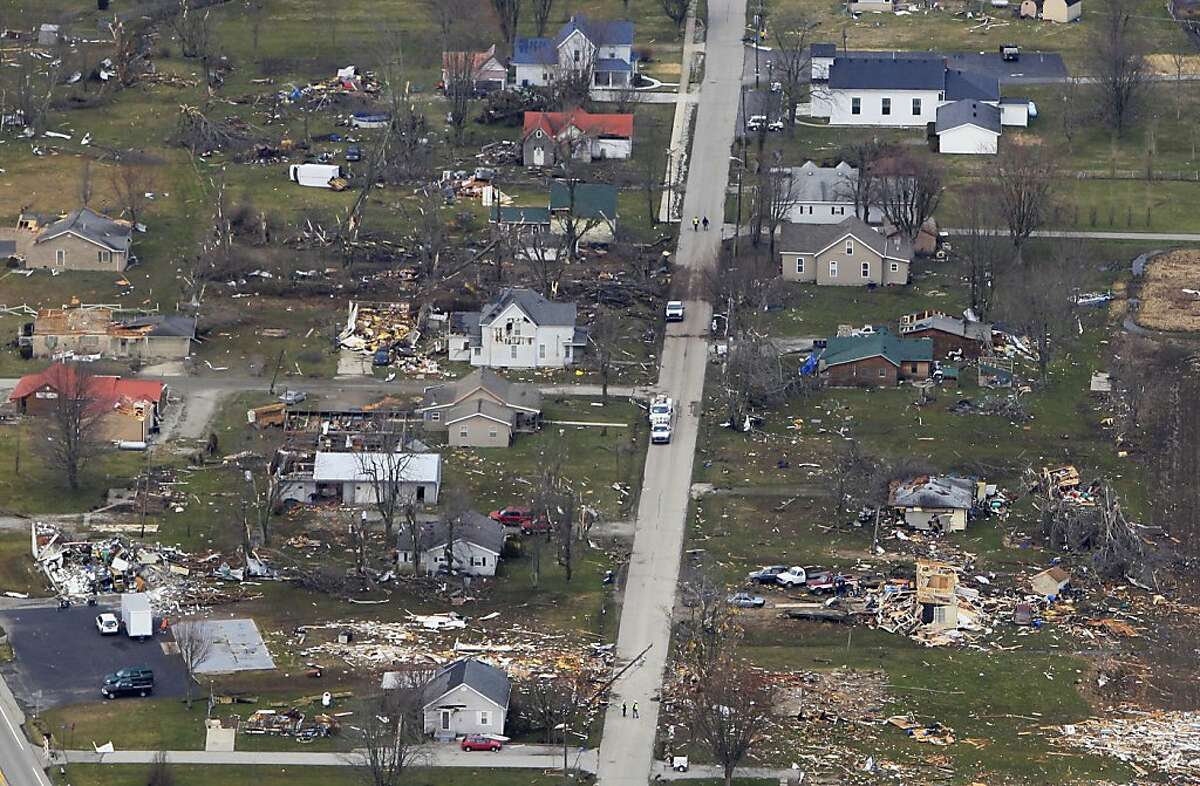 Tornado survivors emerge to find devastation