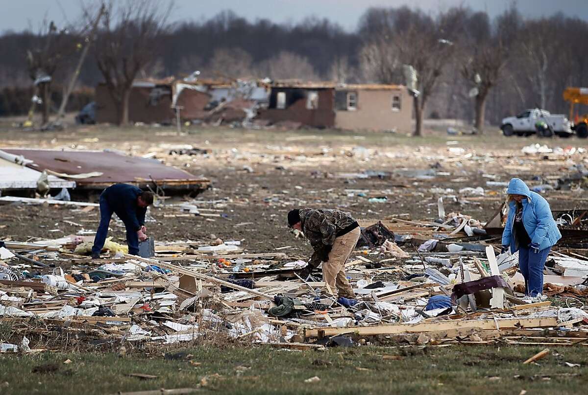 Tornado survivors emerge to find devastation