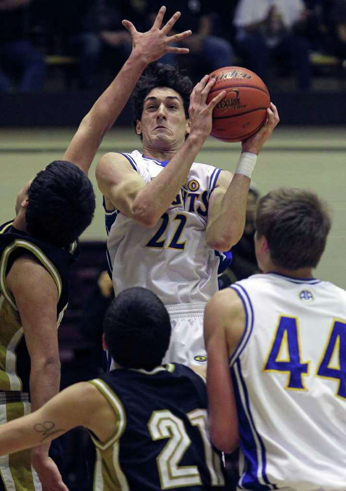 Jeffrey Rodewald goes up in a crowd for a bucket as Alamo Heights beats Edison 50-39 in Region IV 4A finals at Littleton Gym on March 3, 2012 Tom Reel/ San Antonio Express-News