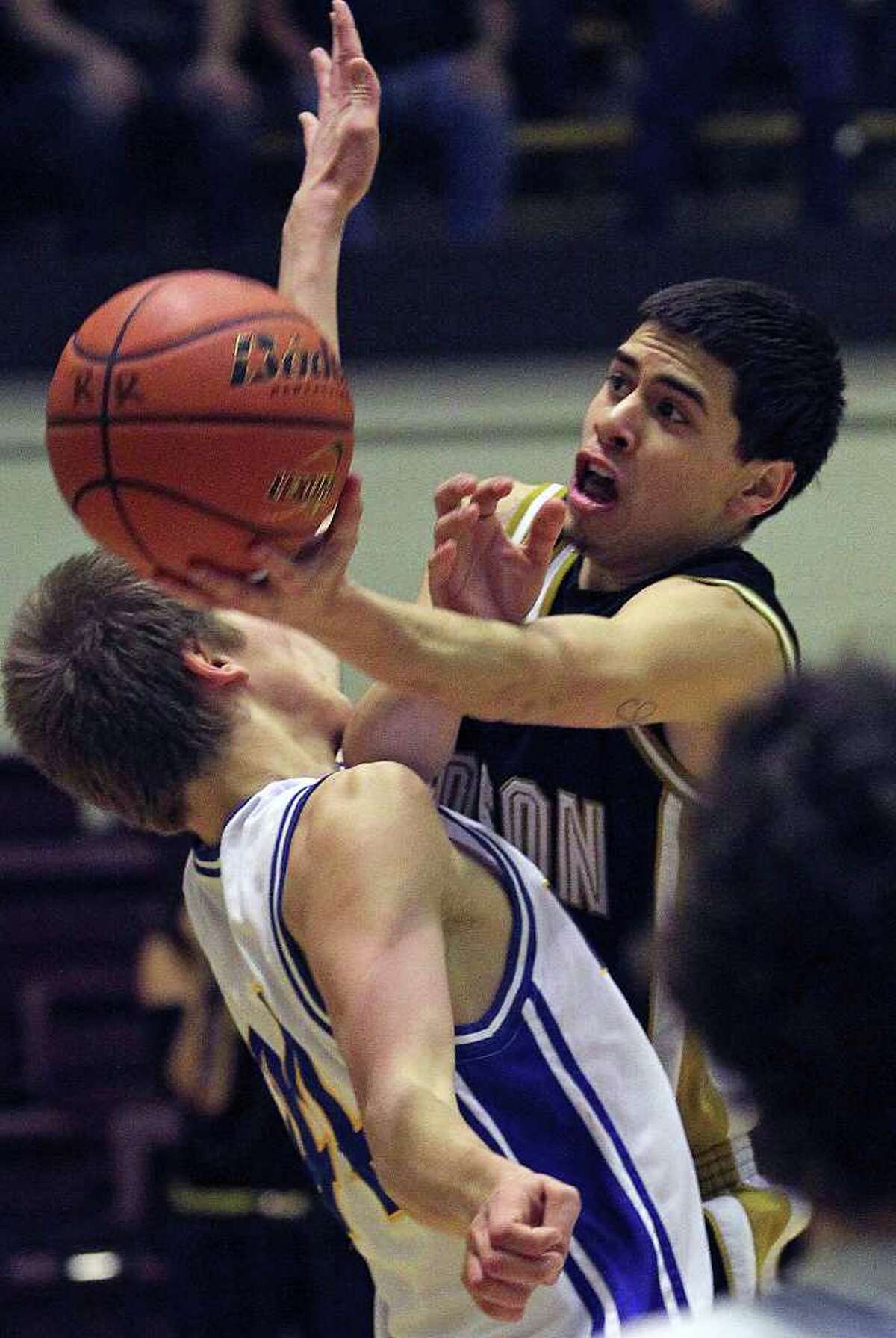 Edison guard Marco Guerrero takes on post Ben Lammers for a shot in the second half as Alamo Heights beats Edison 50-39 in Region IV 4A finals at Littleton Gym on March 3, 2012 Tom Reel/ San Antonio Express-News