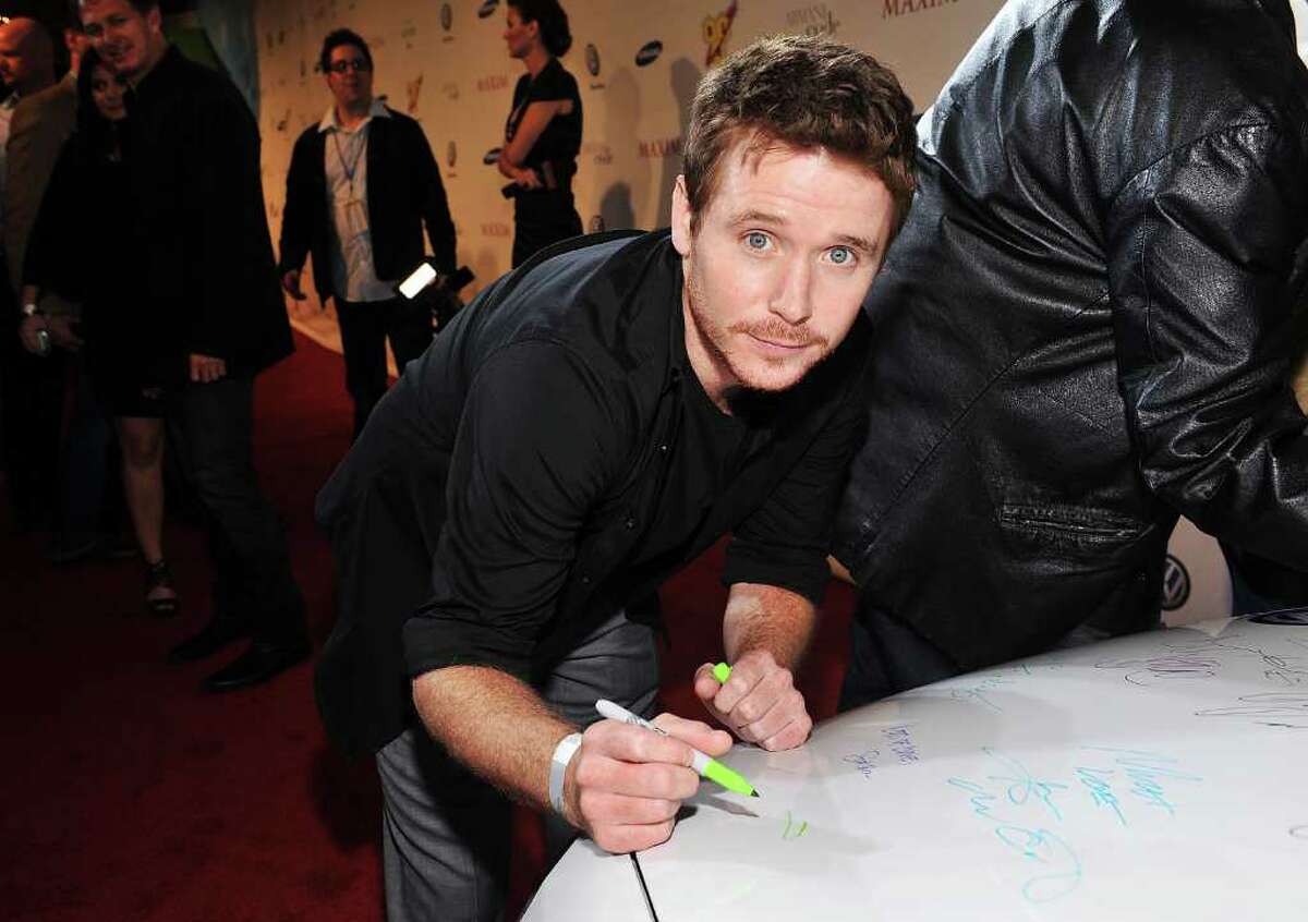 MIAMI - FEBRUARY 06: VW GTI is signed by actor Kevin Connolly at the 2010 Maxim Party at The Raleigh on February 6, 2010 in Miami, Florida. VW, a sponsor of the 2010 Maxim superbowl party, will make a donation to doctors without borders with each signature. The Maxim Party, sponsored in part by VW, exclusive automobile partner. (Photo by Rodrigo Varela/Getty Images for Maxim)